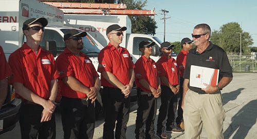 Click image of technicians receiving Master Elite Certification to go to Roof Inspections and Maintenance page