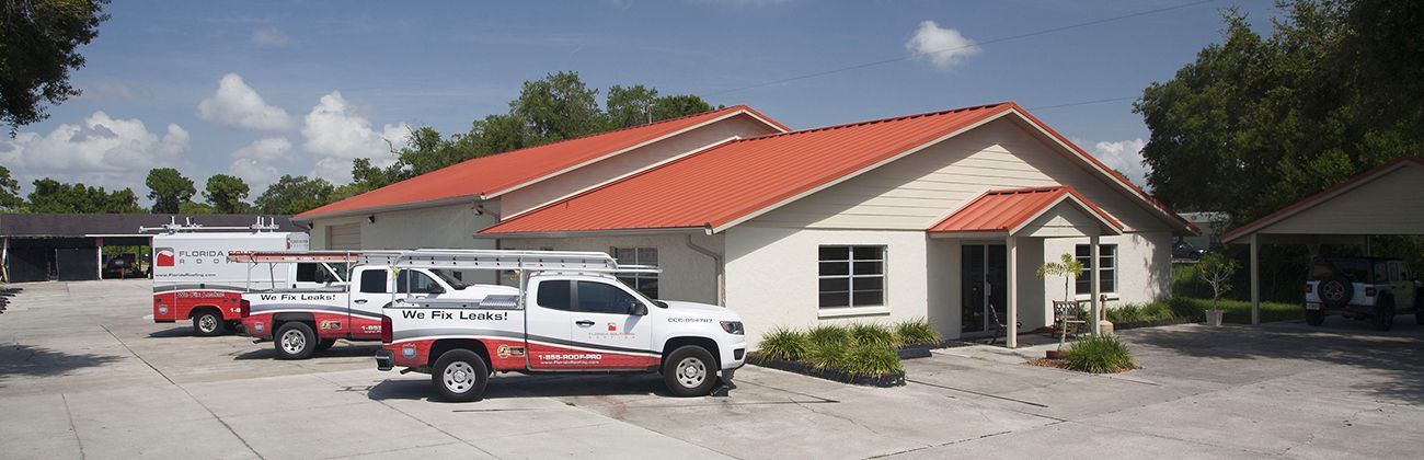 Florida Southern Roofing trucks parked in front of Sarasota Roofing Contractor headquarters