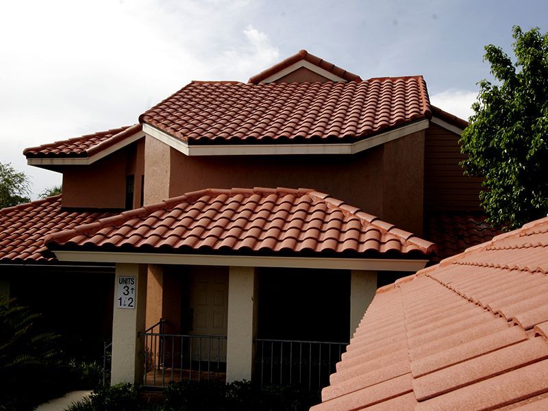 Condominium tile roof  by Florida Southern Roofing.