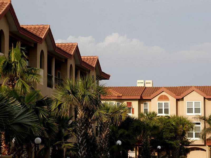 Condominium with tile roofing by Florida Southern Roofing.